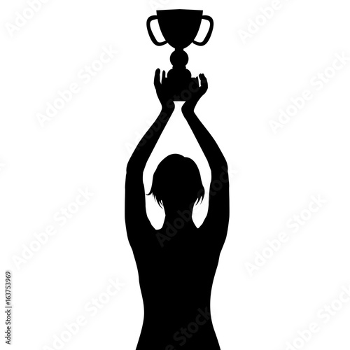 Silhouette of a woman holding a championship trophy