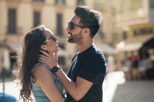 Young man touching his girlfriend tenderly