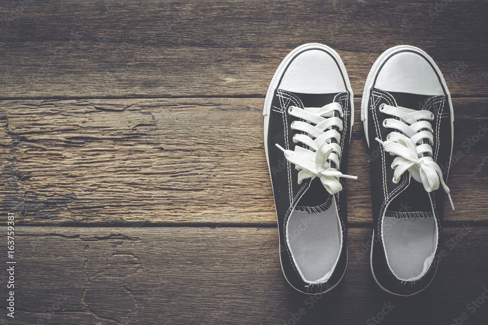 Black shoes on a wooden background with copy space. Black shoes on a wooden background with copy space.