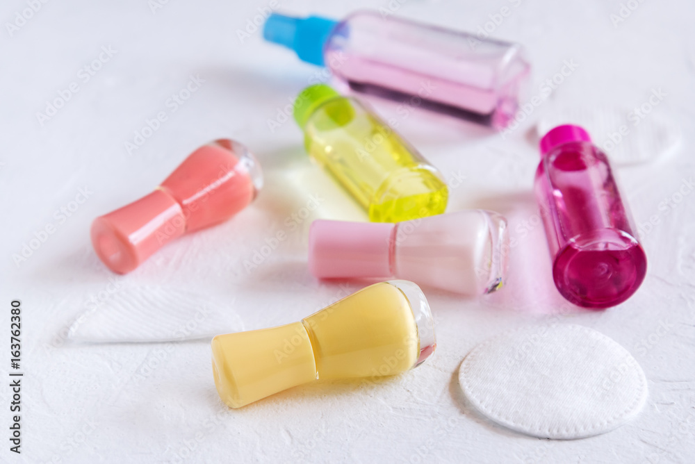 Accessories for manicure or pedicure concept of nail hand and foot care copy space for text or inscription Yellow Pink and red nail Lacquer Accessories for manicure or pedicure concept of nail hand and foot care copy space for text or inscription Yellow Pink and red nail Lacquer