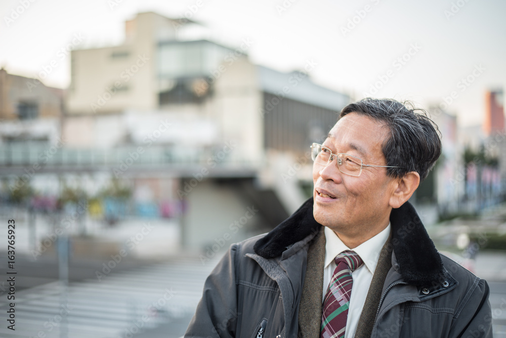 Japanese senior old man outdoors smiling and happy portrait