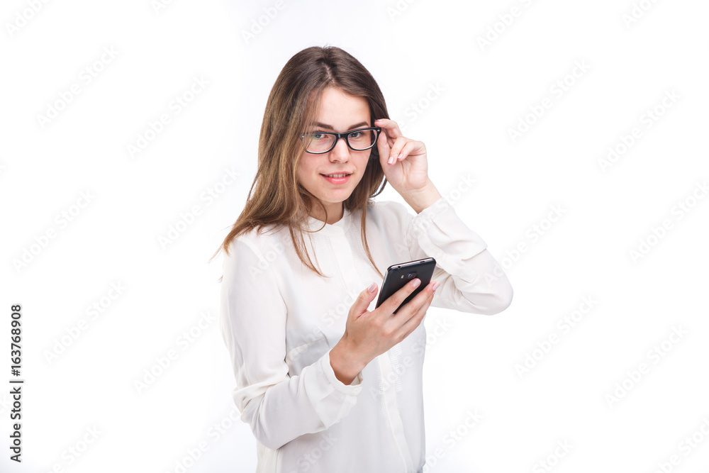 Portrait happy, smiling woman texting on her smart phone, isolated white background. Communication concept. Internet, phone addiction Portrait happy, smiling woman texting on her smart phone, isolated white background. Communication concept. Internet, phone addiction