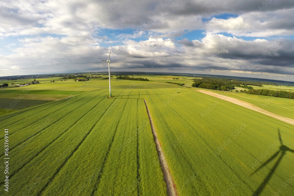 Fototapeta premium Aerial view of summer field with wind turbines, Poland