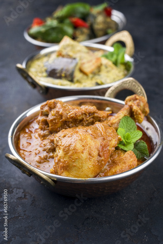 Traditional Indian Curries with Chicken and Vegetable as close-up Korai