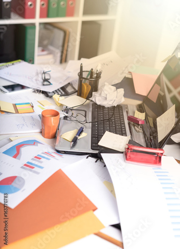 Messy and cluttered desk, light effect