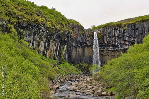 Famous Icelandic Svartifoss waterfall in the basalt (whinstone) canyon placed in Vatnajökull National Park in the eastern Iceland 