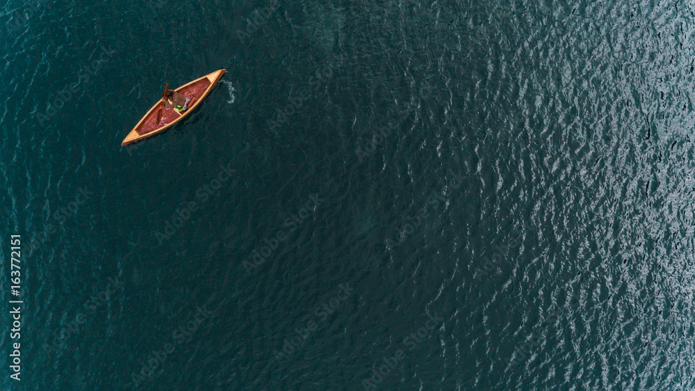 Wooden canoe during navigation Wooden canoe during navigation