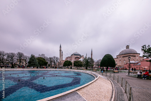 Sultanahmet Park with view of Blue Mosque also called Sultan Ahmed Mosque or Sultan Ahmet Mosque with fountain in the foreground, Istanbul, Turkey.