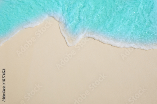 Fototapeta Naklejka Na Ścianę i Meble -  Soft waves of blue sea on the Maldives beach for the background.