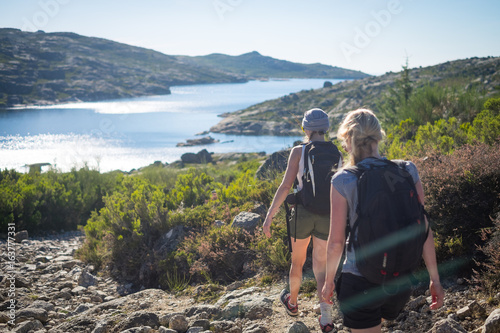 Canvastavla Young women on trip in summer countryside, Tourists in park, Two active women in