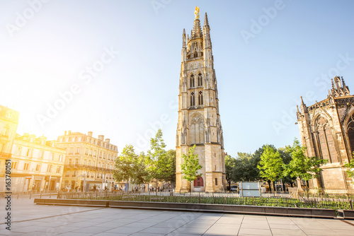 Morning view on the square with saint Pierre cathedral tower in Bordeaux city, France photo