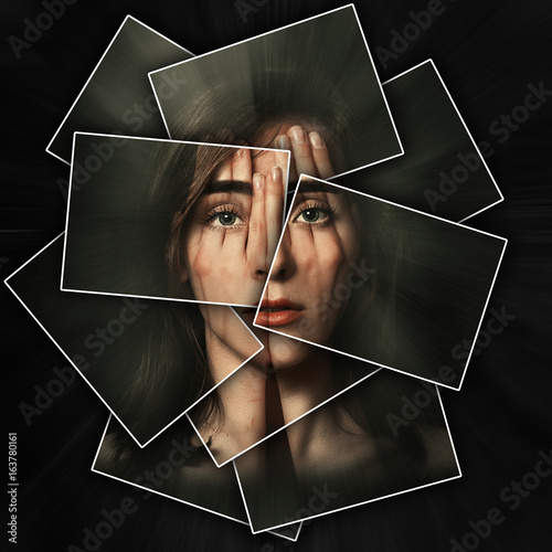 Surreal portrait of a young girl covering her face and eyes with her hands, face shines through hands, face is divided into many parts by cards , double exposure