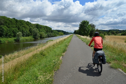 Biker riding on a bicycle path alongside the Morava River in the Czech Republic. Moravian bicycle path .