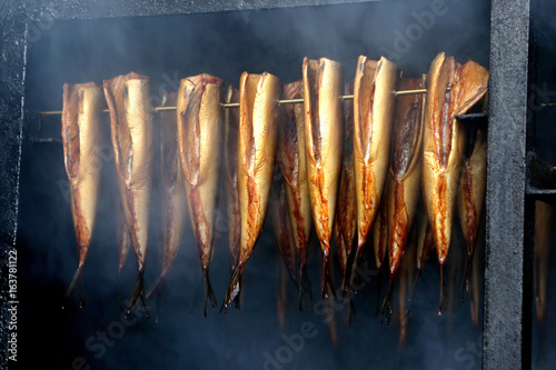 Photography Fresh smoked fish in smoker grill
