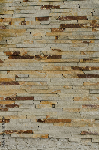 Obraz na płótnie Stone decorated wall w salonie