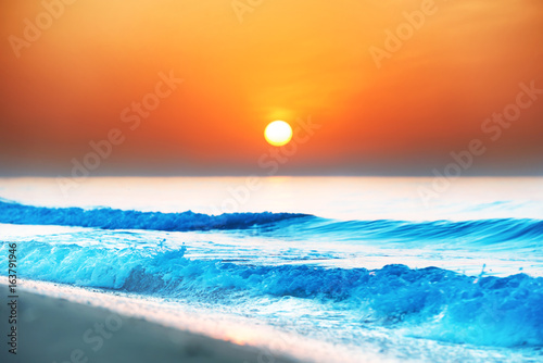 Sunset on the beach with long coastline