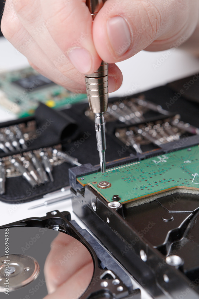 Naklejka premium Hard disc drive disassembling close up