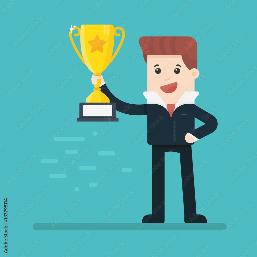 Businessman holding winning trophy Businessman holding winning trophy