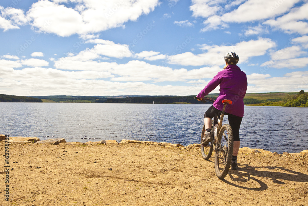 Fototapeta premium Cyclist Near Lake