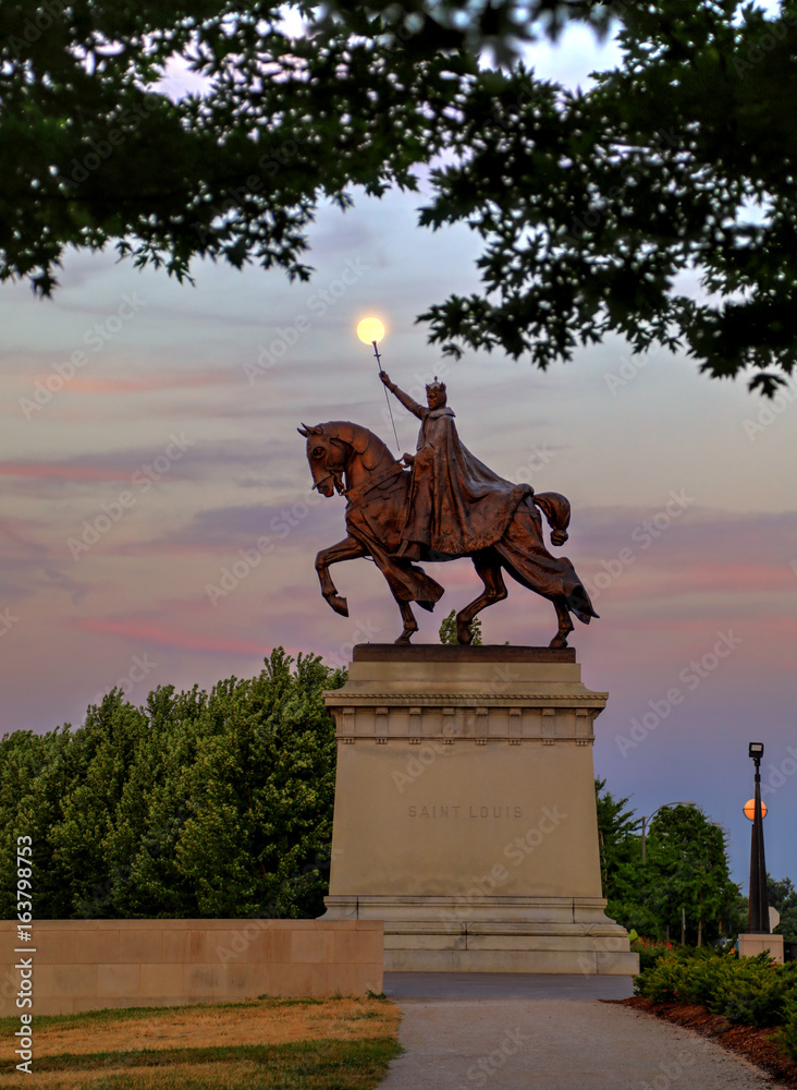 The moon over the Apotheosis of St. Louis statue of King Louis IX of France, namesake of St. Louis, Missouri in Forest Park, St. Louis, Missouri.