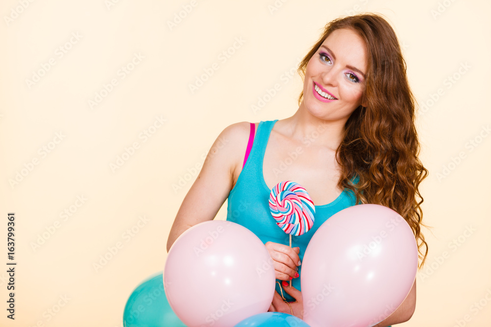Woman with colorful balloons and lollipop Woman with colorful balloons and lollipop