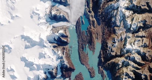 Very high-altitude overflight aerial of Upsala glacier / Lago Argentina in the Southern Patagonian alps. Clip loops and is reversible. Elements of this image furnished by USGS/NASA Landsat