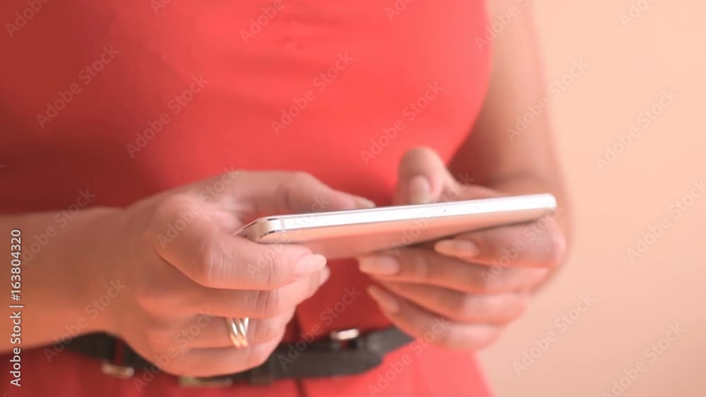 Woman typing text on smartphone Woman typing text on smartphone