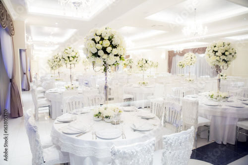 Beautifully decorated in white colours wedding hall © fotosr52