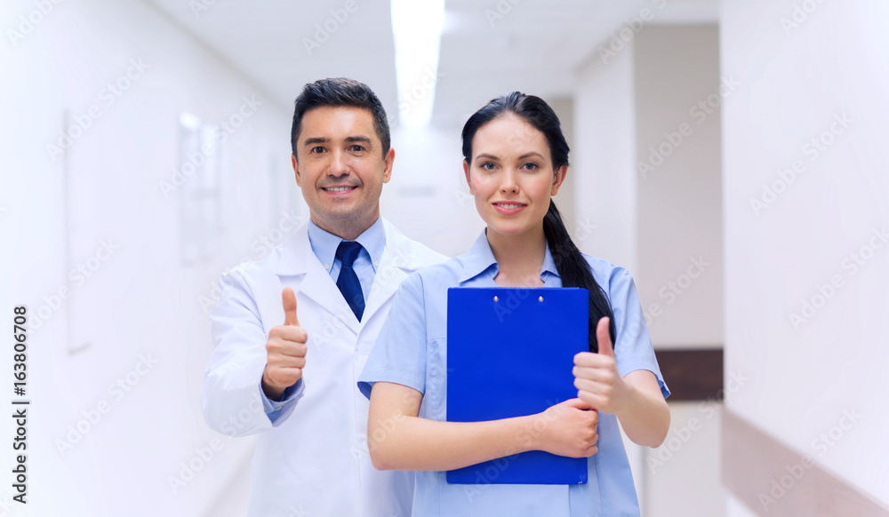 doctor and nurse showing thumbs up at hospital doctor and nurse showing thumbs up at hospital