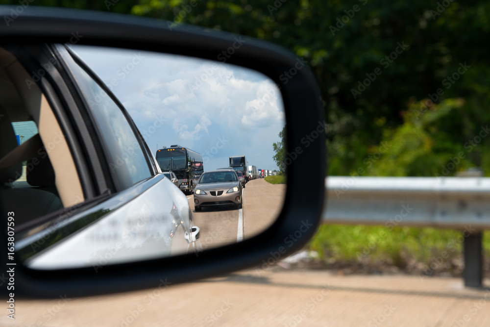 Traffic jam seen through rearview mirror