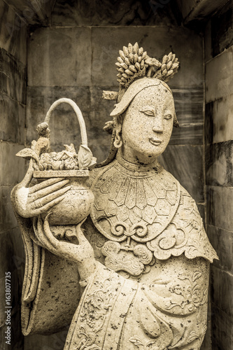 old statue in public in Thailand with dramatic tone