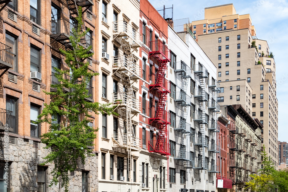 Block of colorful old apartment buildings in the East Village of Manhattan New York City