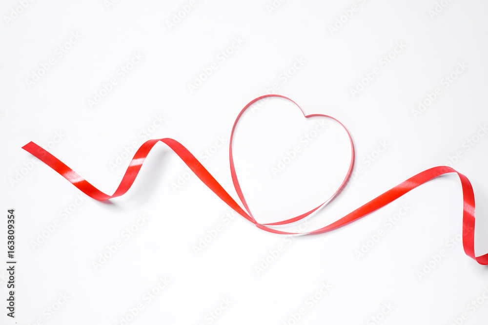 Festive red ribbon isolated on white background Festive red ribbon isolated on white background
