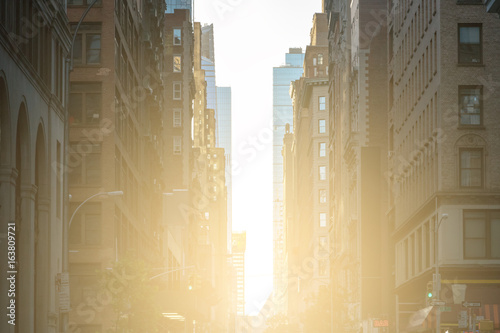 Photography Sunlight shines down the crowded streets of New York City