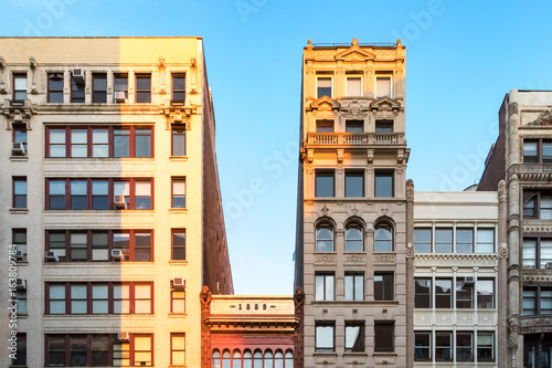 Row of old building rooftops in New York City photo