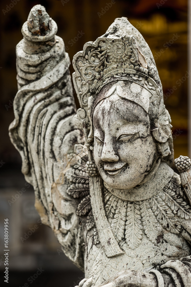 old statue in public temple in Thailand with dramatic tone old statue in public temple in Thailand with dramatic tone