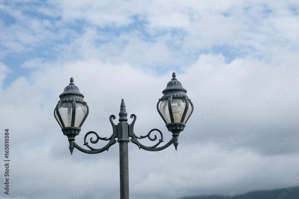 Street lamp on cloud and sky background