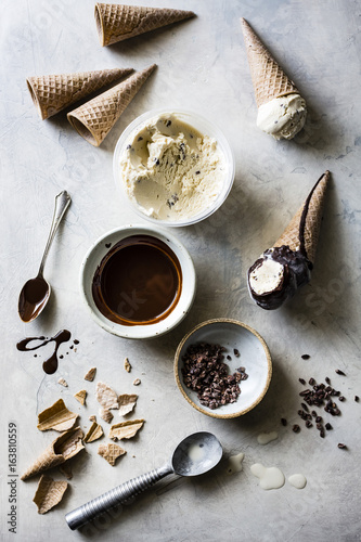 Choc chip ice cream cone dipped in a chocolate sauce