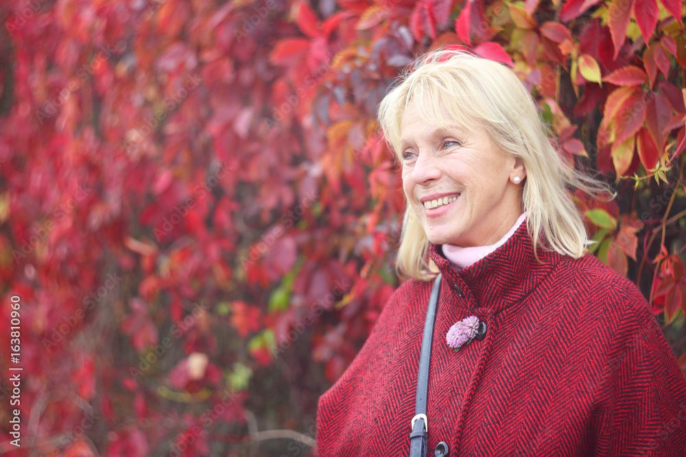 Senior woman in autumn park Senior woman in autumn park