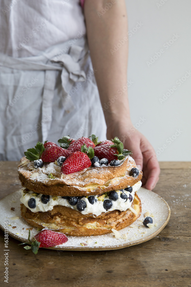 A layereed cream sponge and fruit cake A layereed cream sponge and fruit cake