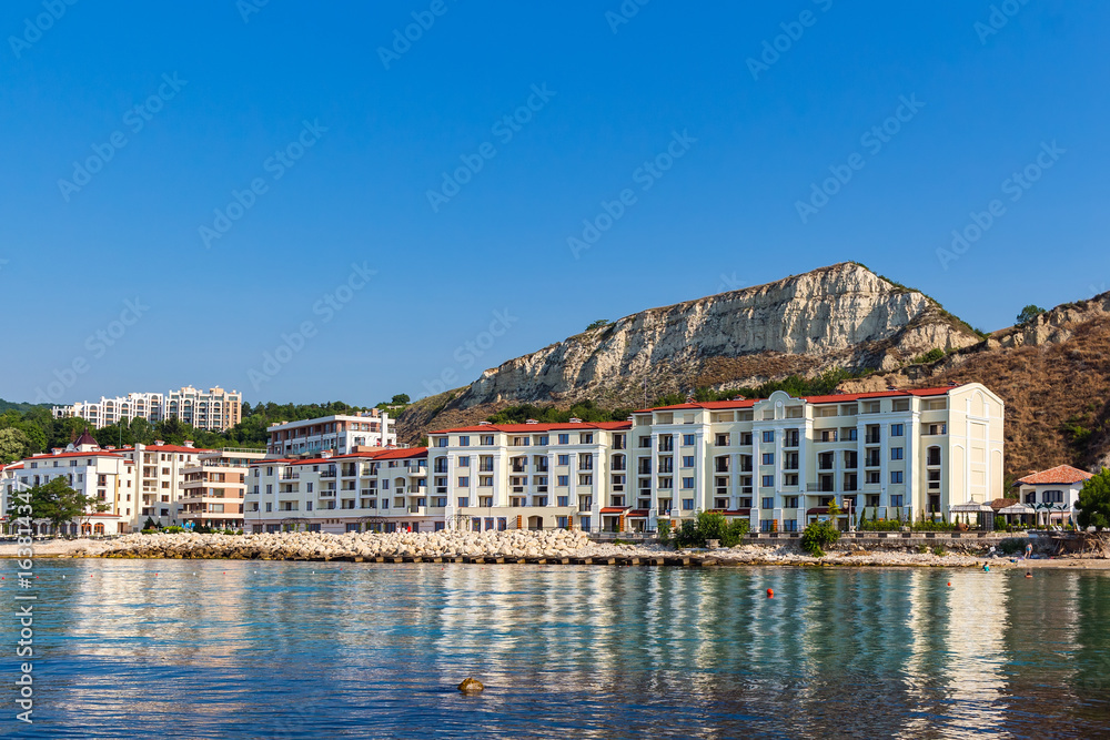 Apartment buildings on seashore in balchik city on black sea coast in Bulgaria at sunny summer day