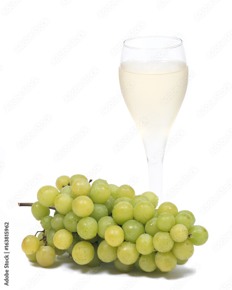 Glass of white wine and ripe organic green grapes isolated on white background Glass of white wine and ripe organic green grapes isolated on white background