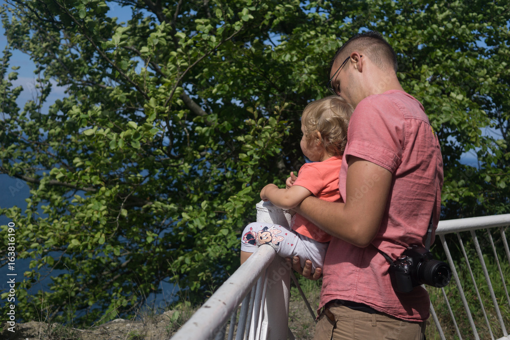 father shows his daughter something interesting father shows his daughter something interesting