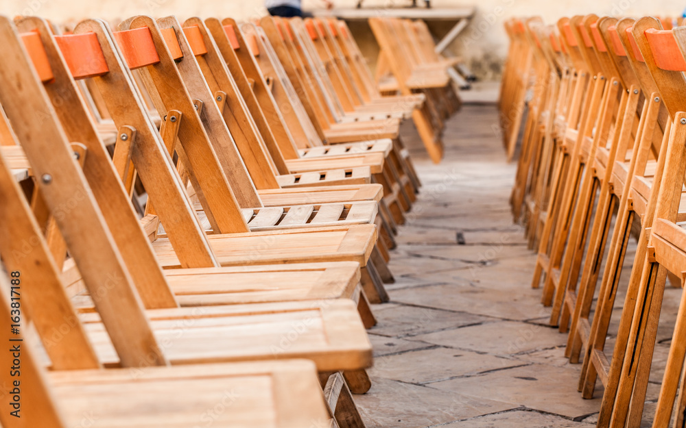 Row of wooden chairs from side Row of wooden chairs from side