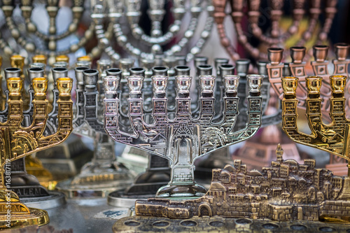 Menorah, a seven-lamp candelabrum used in contemporary Jewish temples sold at Carmel Market, popular marketplace in Tel-Aviv. Israel photo