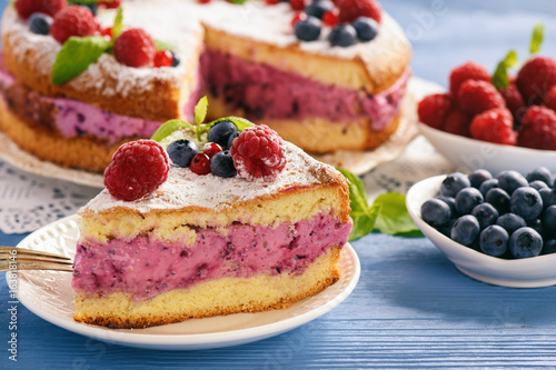 Delicious homemade cake with berry cheese cream.