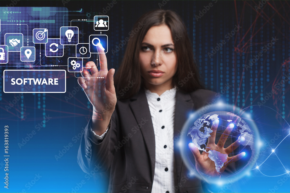 The concept of business, technology, the Internet and the network. A young entrepreneur working on a virtual screen of the future and sees the inscription: Software The concept of business, technology, the Internet and the network. A young entrepreneur working on a virtual screen of the future and sees the inscription: Software