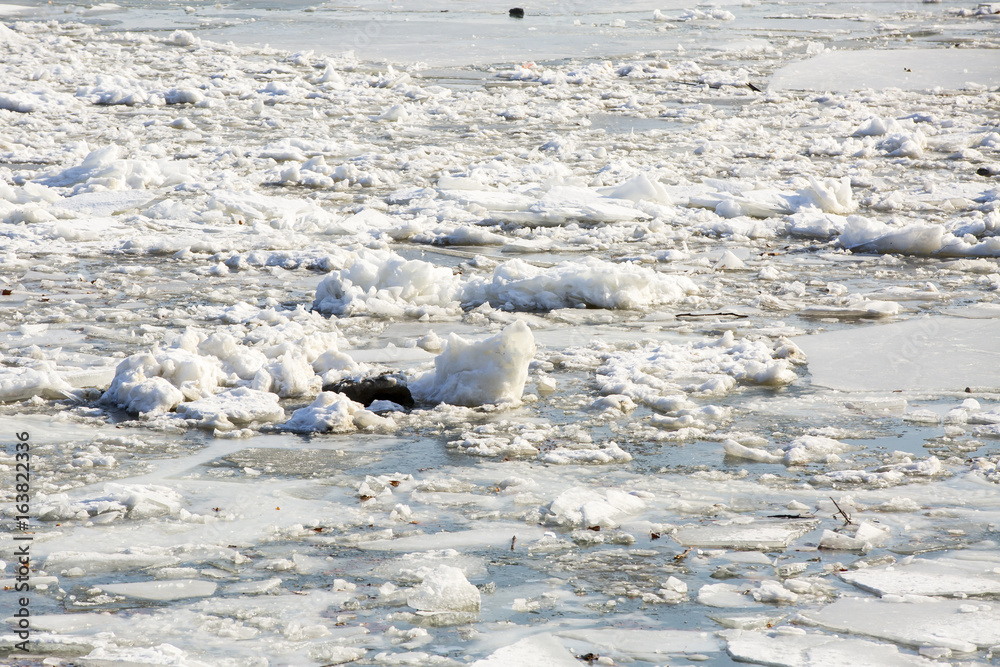 big chunk of ice in the river Danube on a winter day, near a coast big chunk of ice in the river Danube on a winter day, near a coast