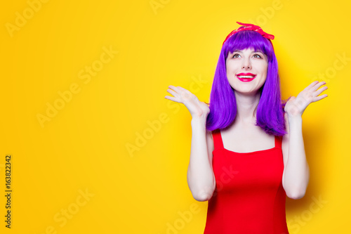 Portrait of young girl with purple color hair