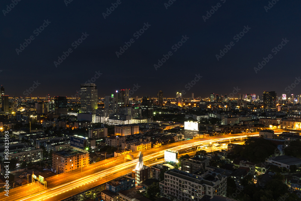 Cityscape and light of night road in long exposure